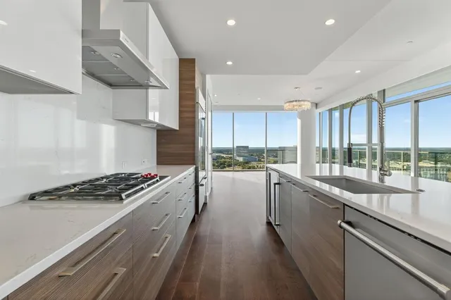 a kitchen with stove and cabinets
