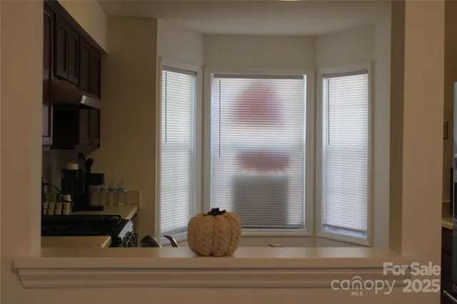 a kitchen with stainless steel appliances granite countertop a stove a microwave and cabinets