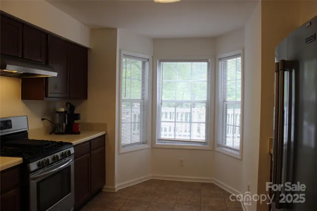 a kitchen with a sink and a stove
