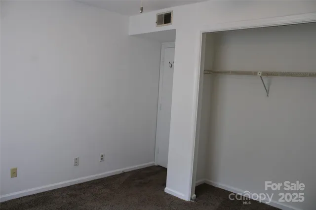 an empty room with fan