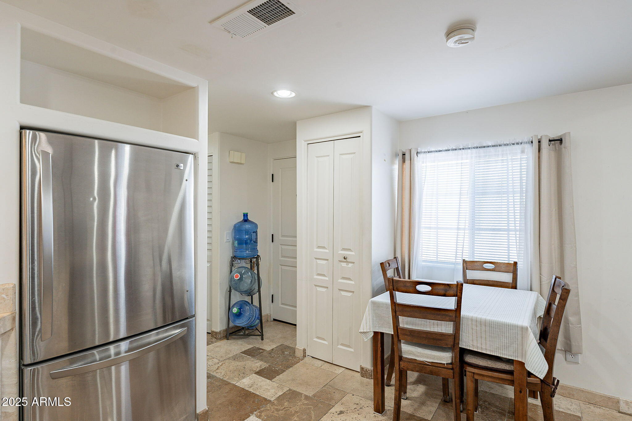 15606 South Gilbert Road, Unit 63 Chandler, AZ 85225 - Photo 11 of 21 a view of kitchen with furniture and refrigerator