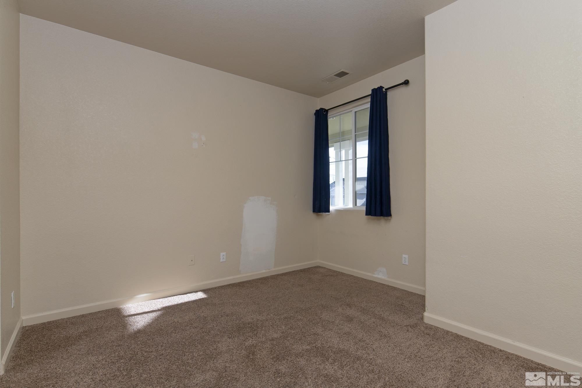 8987 Sorcha Street Reno, NV 89506 - Photo 14 of 29 a view of an empty room with a window