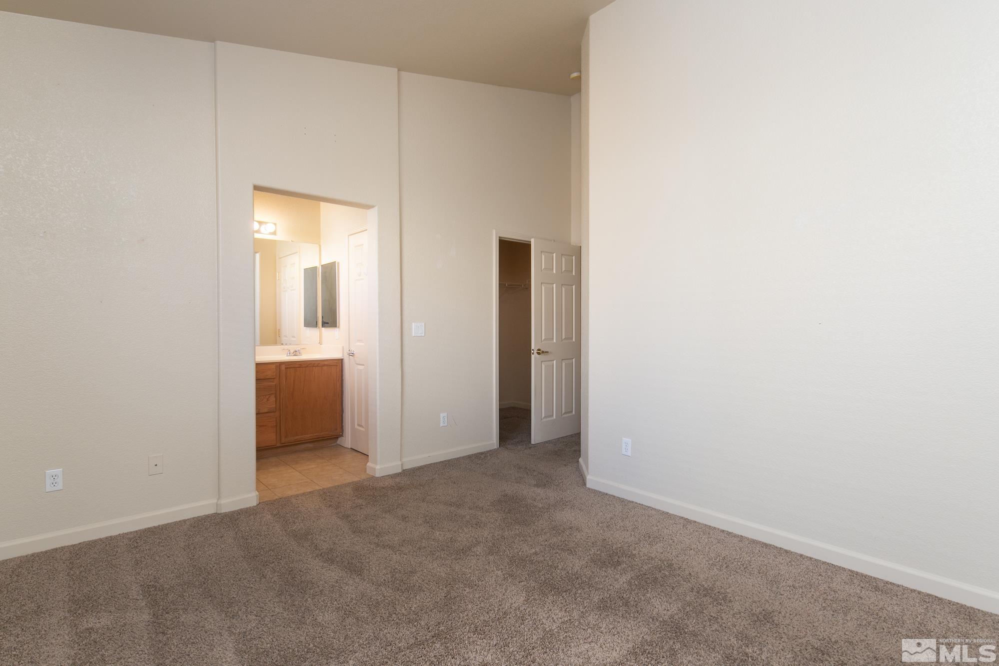 8987 Sorcha Street Reno, NV 89506 - Photo 22 of 29 a view of an empty room and a bathroom