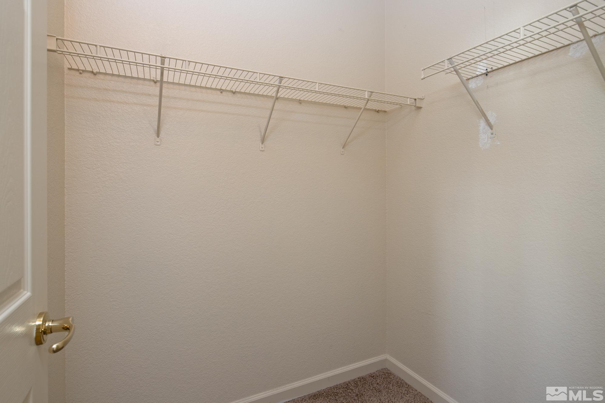 8987 Sorcha Street Reno, NV 89506 - Photo 24 of 29 a view of a room with racks on the wall
