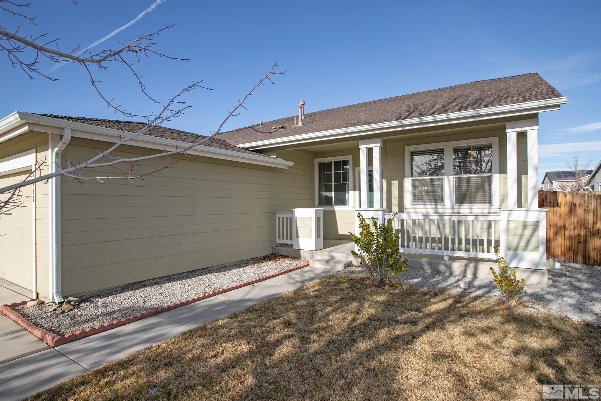 8987 Sorcha Street Reno, NV 89506 - Photo 3 of 29 a view of a house with a yard and wooden floor