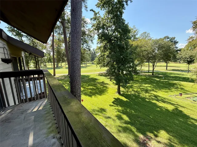 a view of swimming pool from a balcony