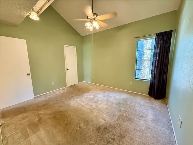 a bathroom with a tub shower and sink