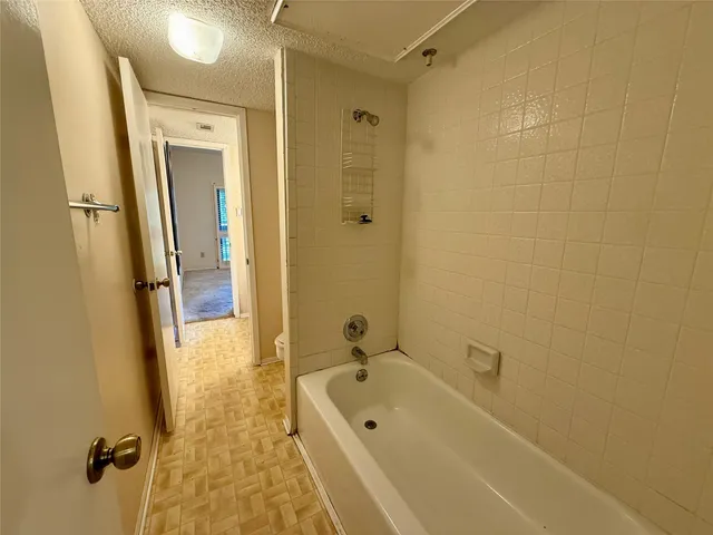 a bathroom with a double vanity sink a mirror and a shower