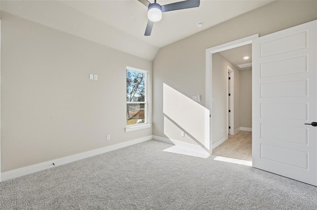 1053 Llano Way Poolville, TX 76487 - Photo 36 of 40 an empty room with windows and ceiling fan