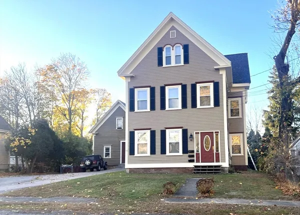 a front view of a house with a yard
