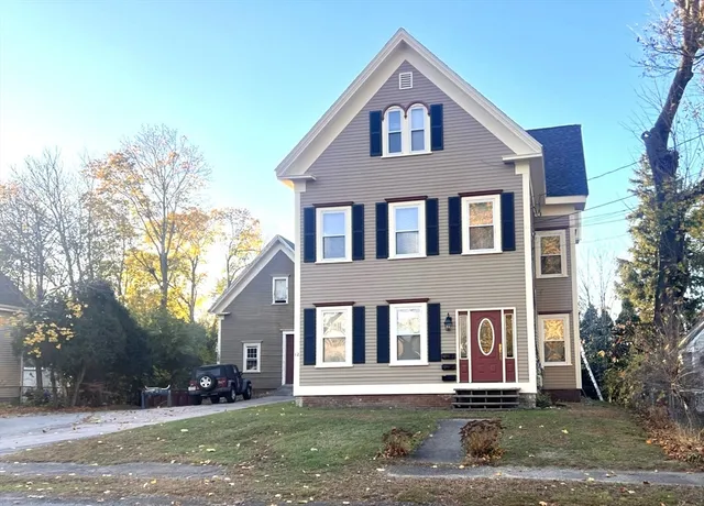a front view of a house with a yard