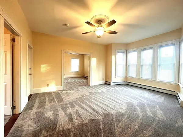 a view of an empty room with a window