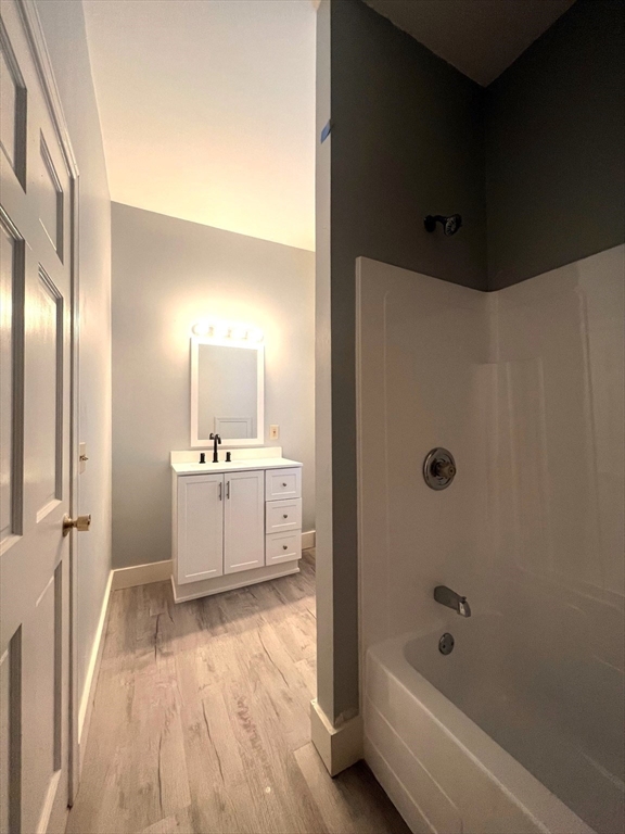 12 Myrtle Street, Unit 2 Middleboro, MA 02346 - Photo 9 of 14 a bathroom with a bathtub and a sink