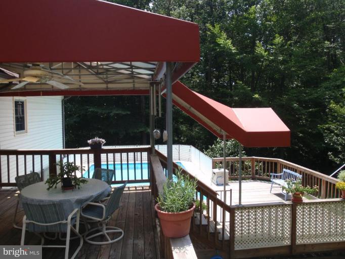 8230 Honeysuckle Road Manassas, VA 20112 - Photo 12 of 15 Covered Deck and lower deck to pool