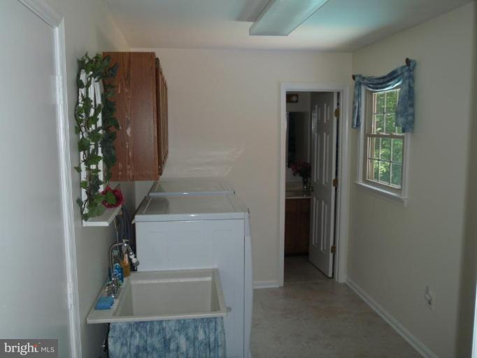 8230 Honeysuckle Road Manassas, VA 20112 - Photo 14 of 15 Laundry Room with wash tub
