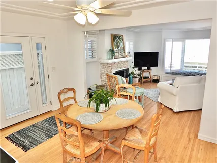 a kitchen with granite countertop white cabinets white stainless steel appliances and a sink