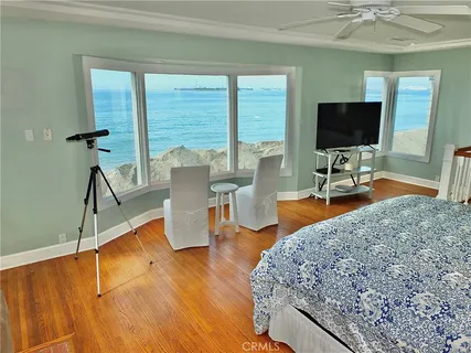a bedroom with a bed and a fireplace