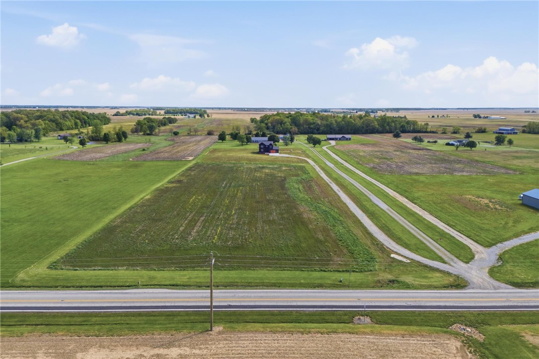 3509 South State Rte 72 Sabina, OH 45169 - Photo 38 of 44 Expansive rural landscape featuring lush fields and a charming property.