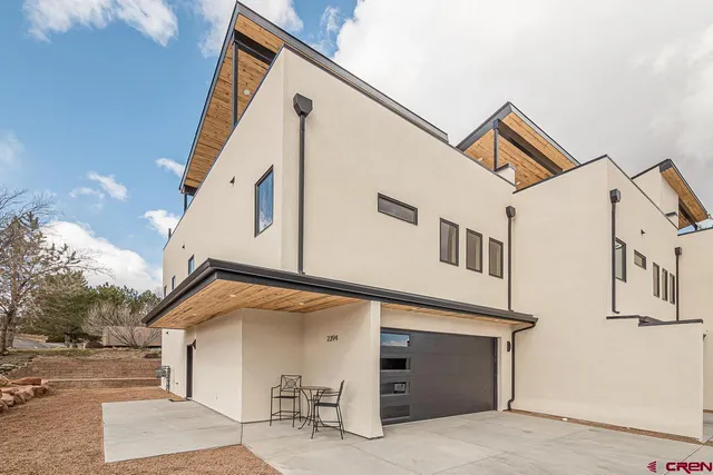 a view of backyard with seating space