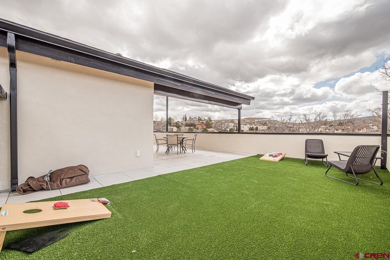 2398 Ridge Cir Drive, Unit B Grand Junction, CO 81507 - Photo 27 of 30 a view of swimming pool with a table and chairs