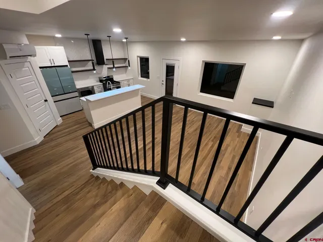 a view of a hallway with seating area