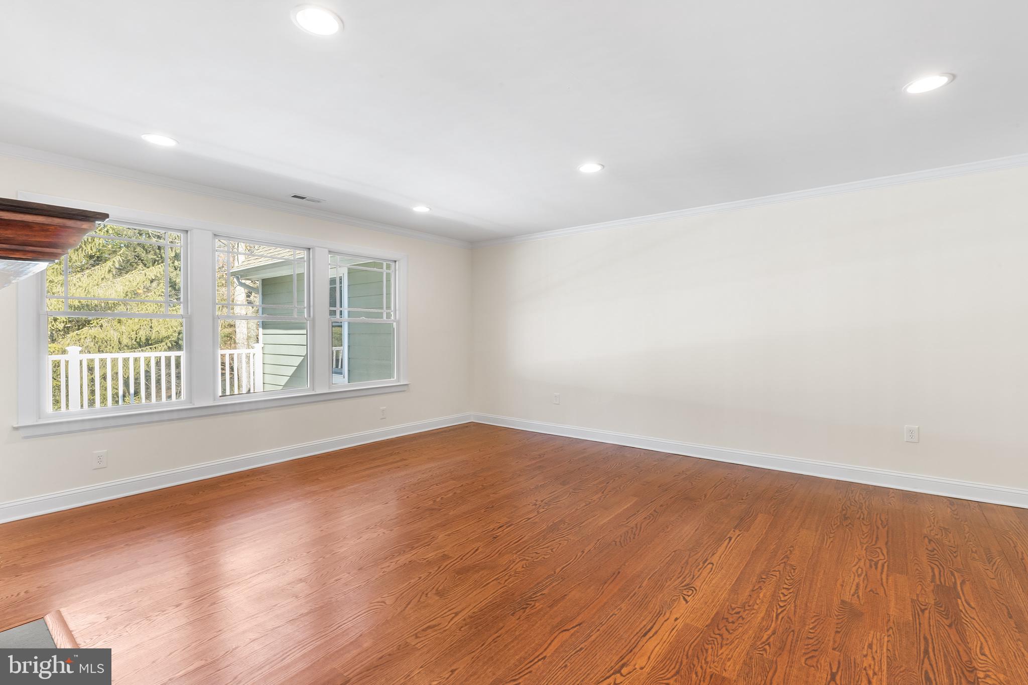 117 Glen Valley Road Yardley, PA 19067 - Photo 13 of 34 an empty room with wooden floor and windows