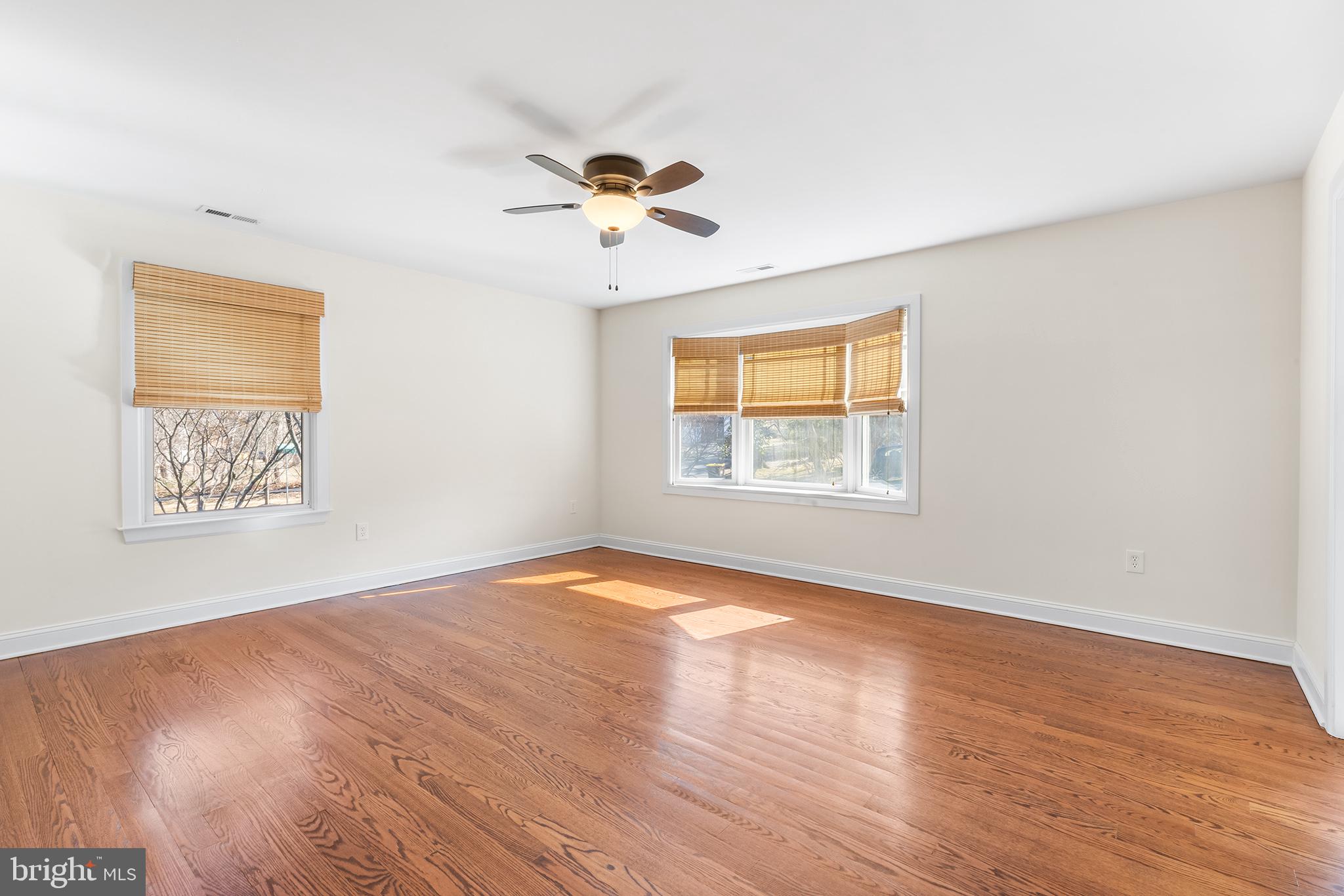 117 Glen Valley Road Yardley, PA 19067 - Photo 15 of 34 a view of an empty room with a window and wooden floor