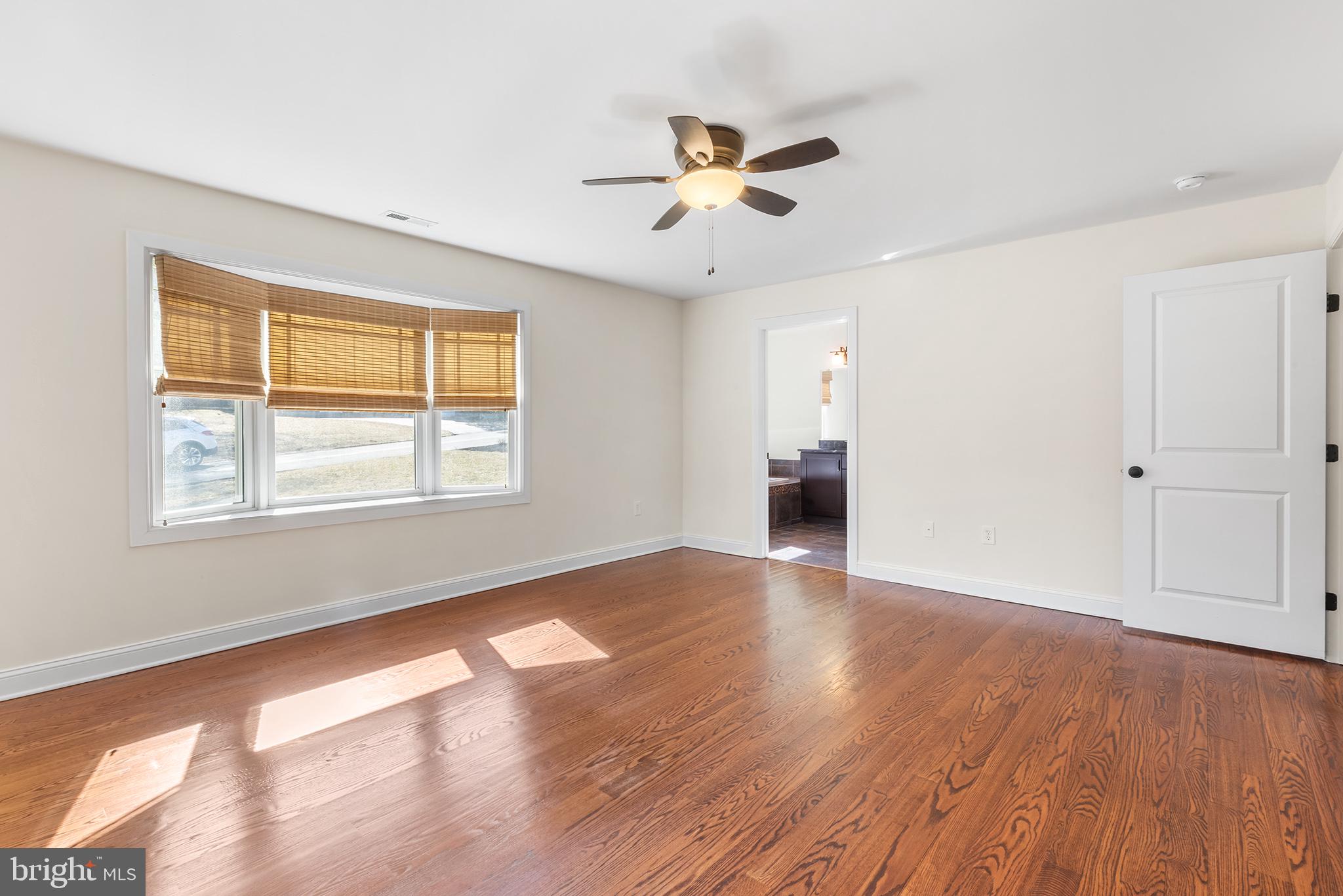 117 Glen Valley Road Yardley, PA 19067 - Photo 17 of 34 a view of an empty room with wooden floor and a window