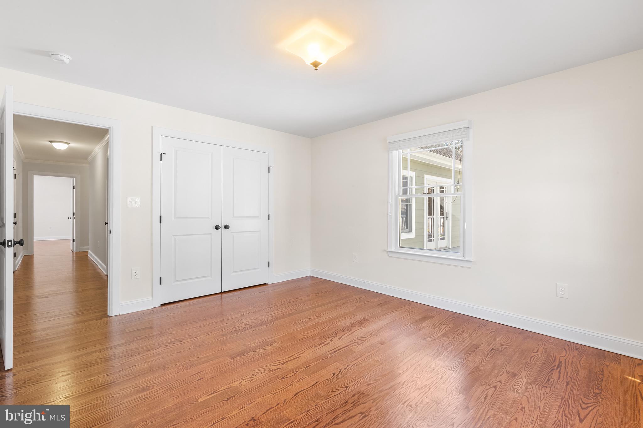 117 Glen Valley Road Yardley, PA 19067 - Photo 23 of 34 an empty room with wooden floor and windows