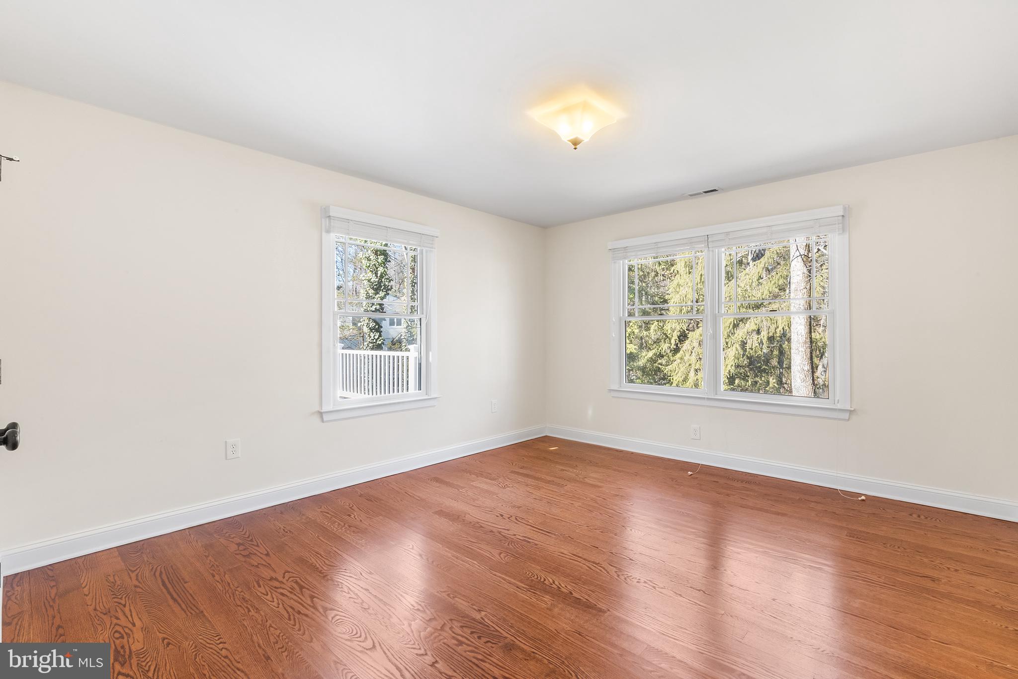 117 Glen Valley Road Yardley, PA 19067 - Photo 24 of 34 a view of an empty room with wooden floor and window