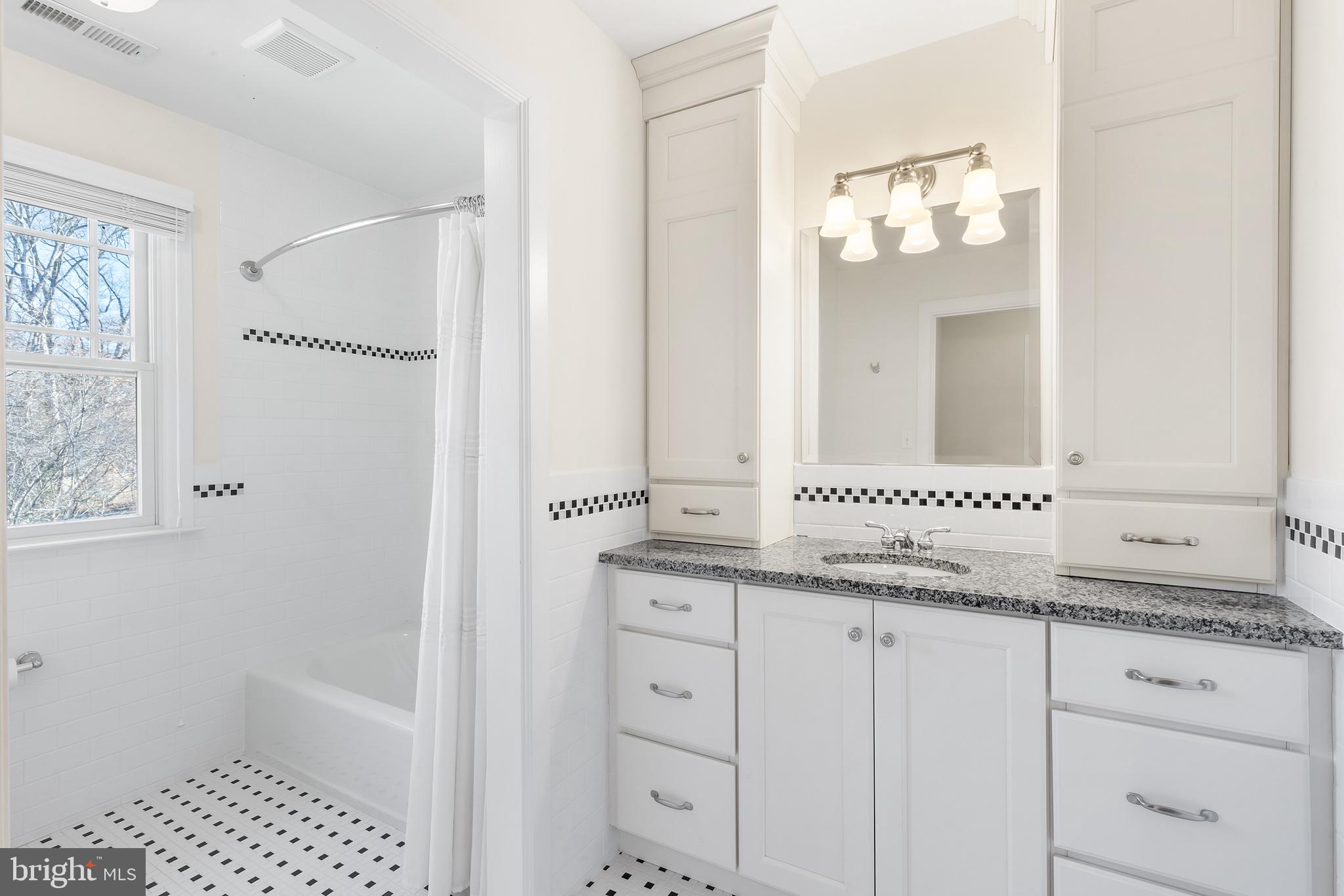 117 Glen Valley Road Yardley, PA 19067 - Photo 25 of 34 a bathroom with a granite countertop sink and a mirror