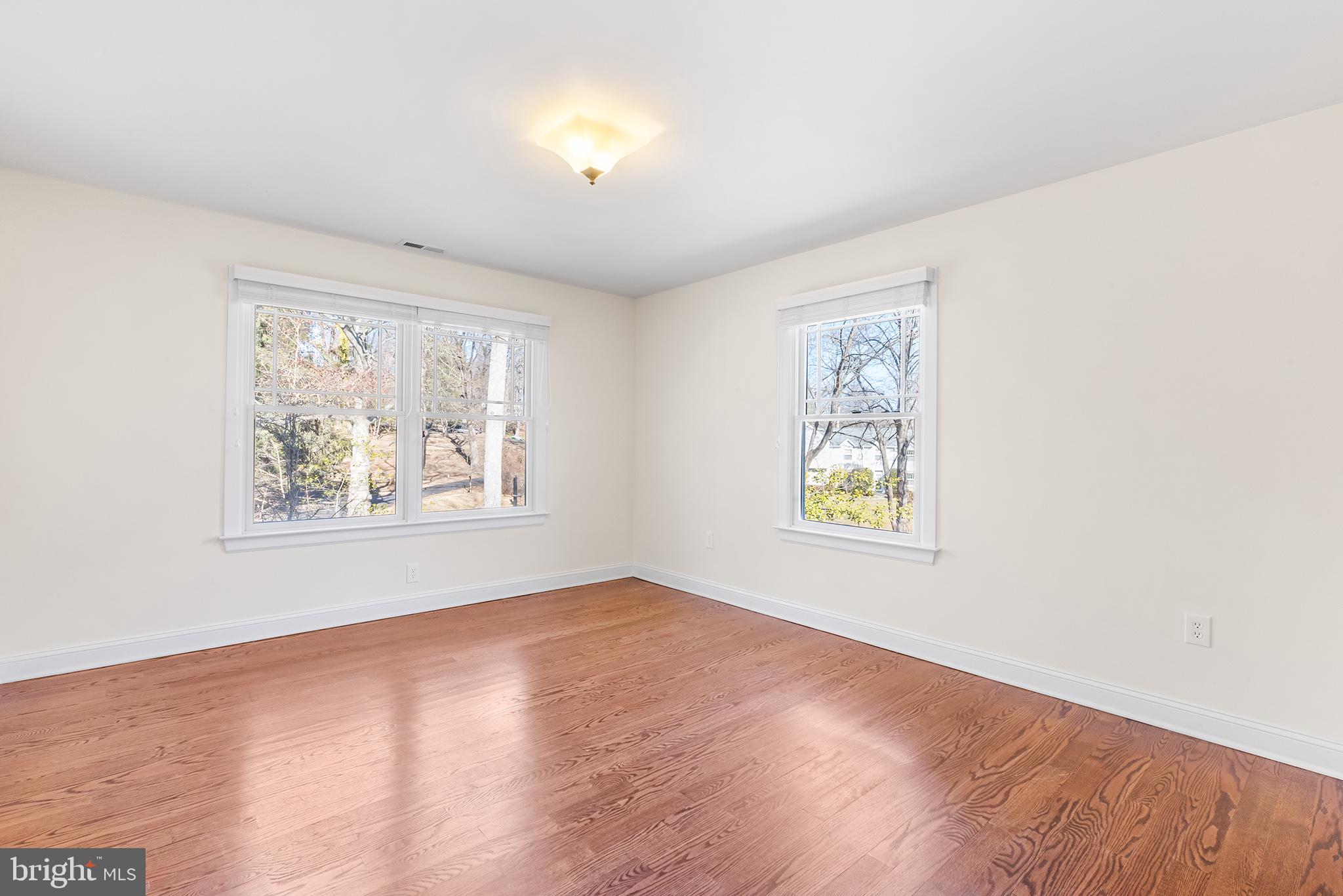 117 Glen Valley Road Yardley, PA 19067 - Photo 26 of 34 a view of an empty room with window and wooden floor