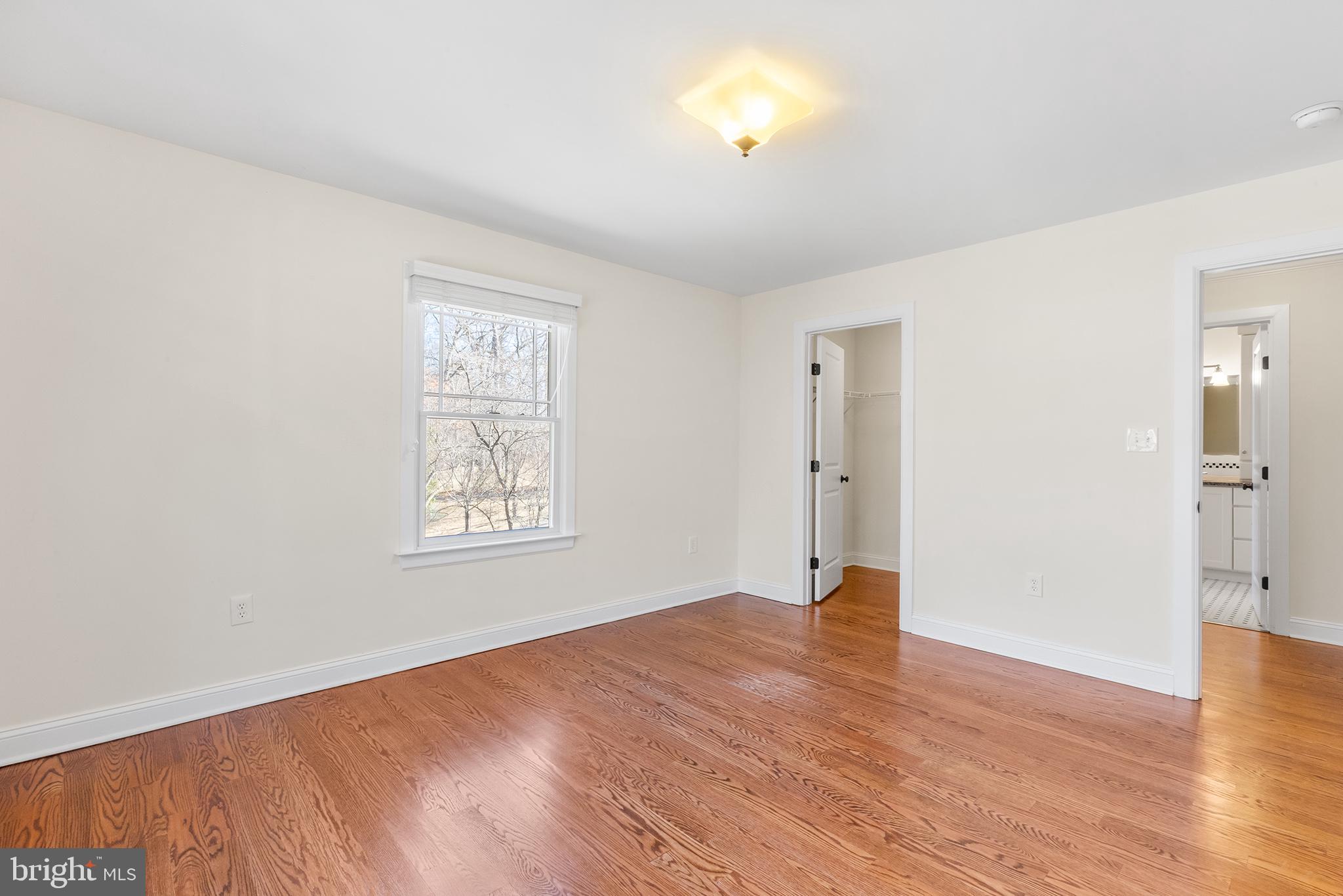 117 Glen Valley Road Yardley, PA 19067 - Photo 27 of 34 an empty room with wooden floor and windows