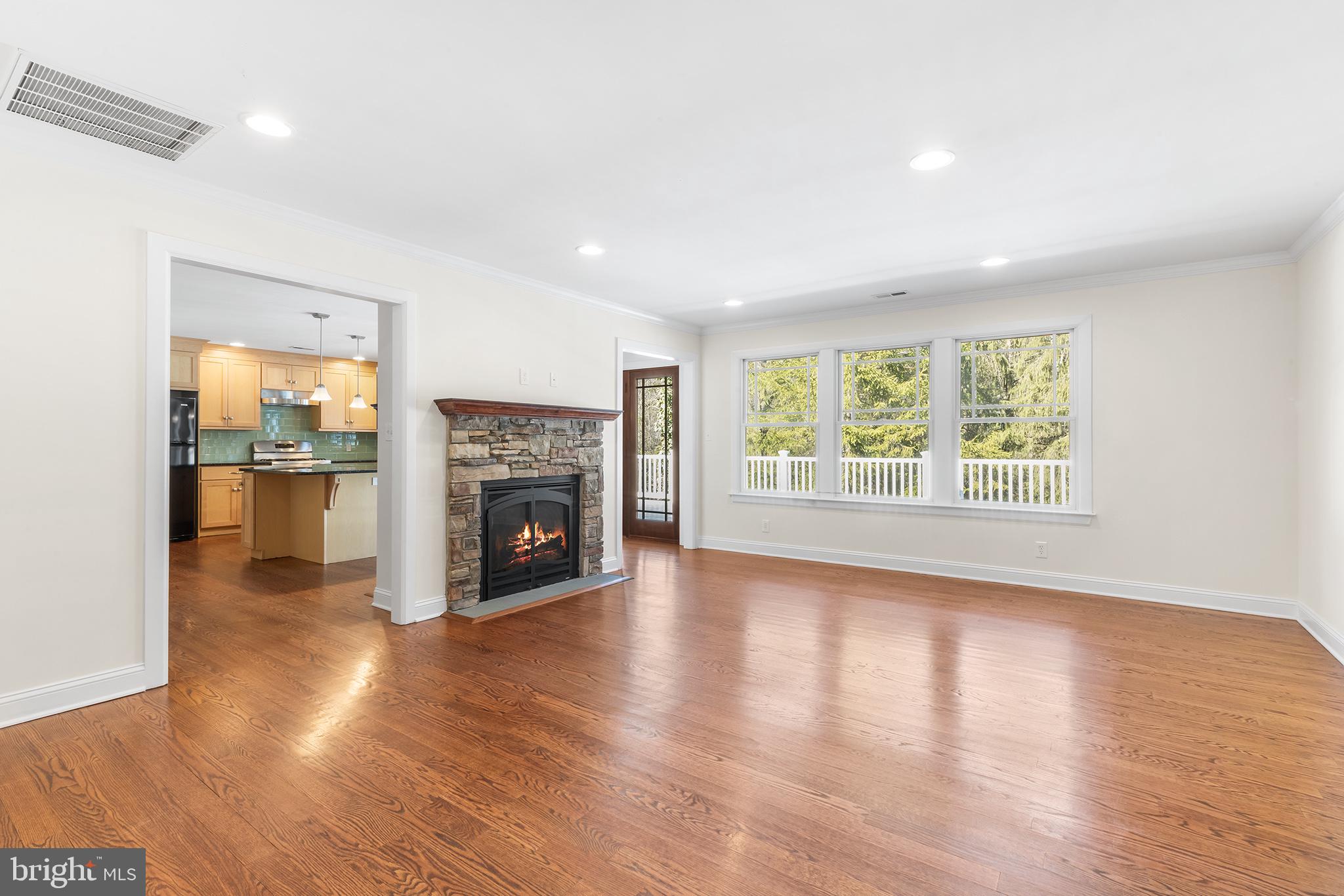 117 Glen Valley Road Yardley, PA 19067 - Photo 6 of 34 a view of a livingroom with fireplace wooden floor and windows