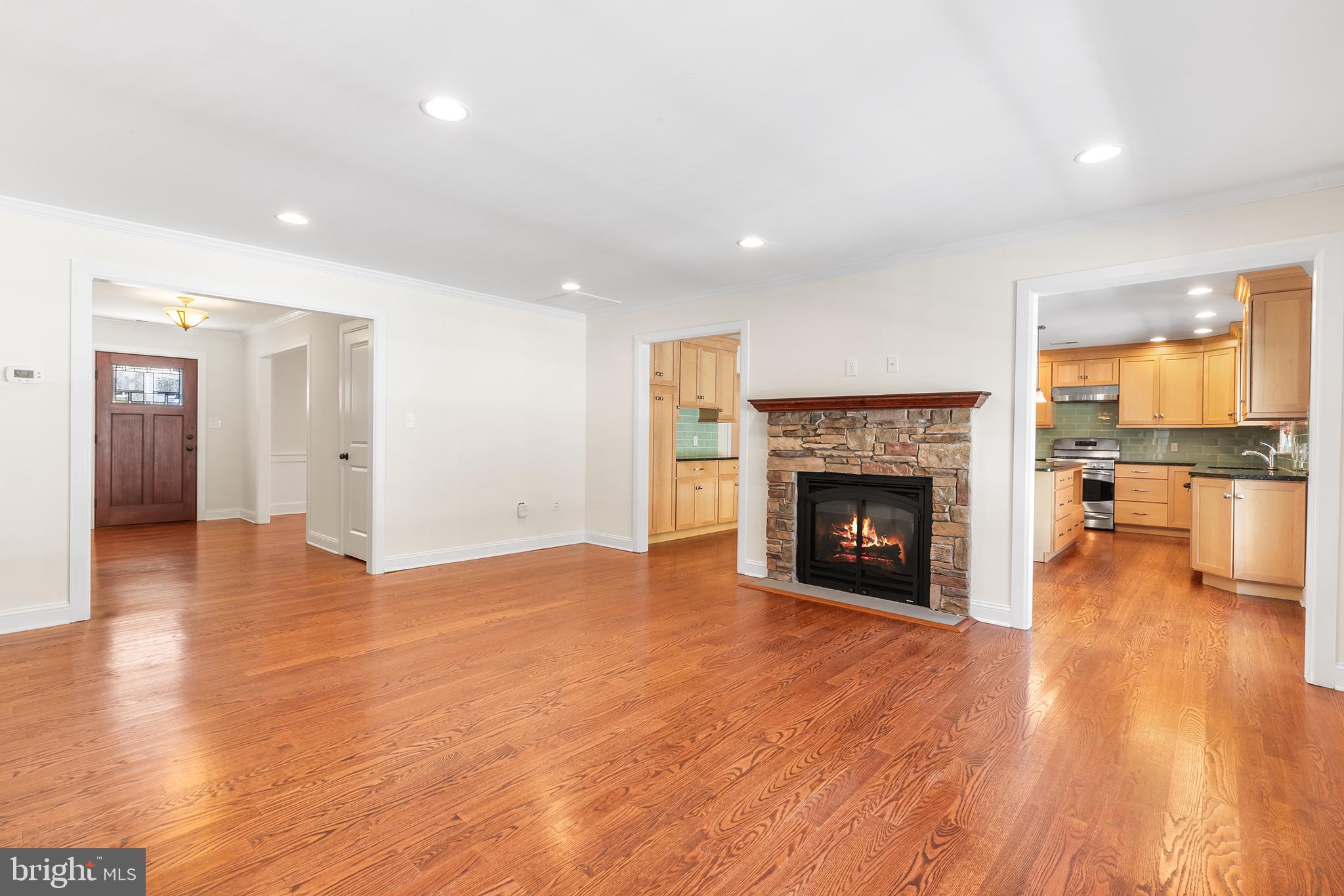 117 Glen Valley Road Yardley, PA 19067 - Photo 7 of 34 a view of a room with wooden floor and a fireplace