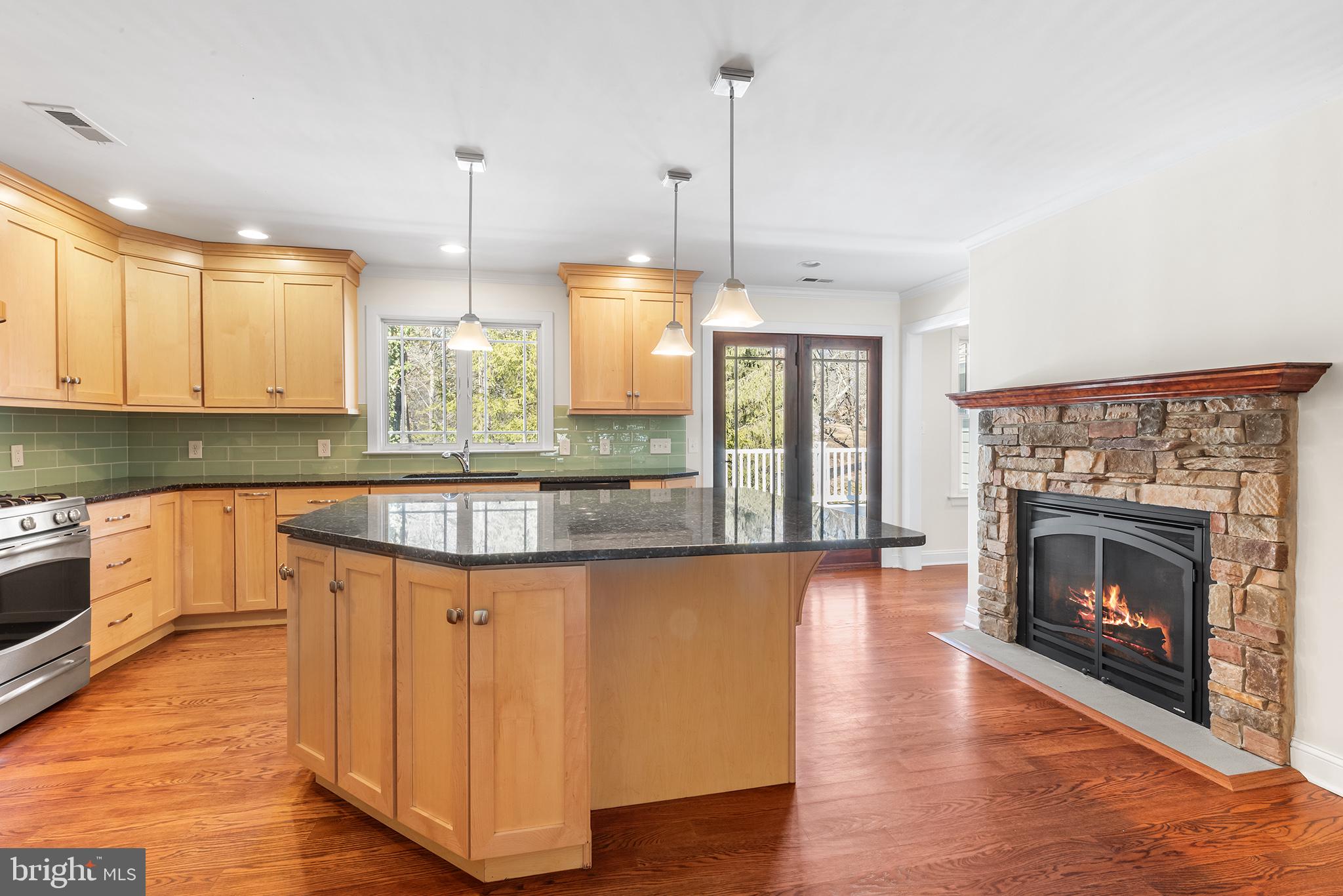 117 Glen Valley Road Yardley, PA 19067 - Photo 10 of 34 a kitchen with wooden floor and a large window