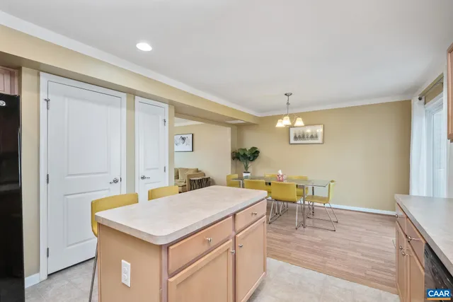 a living room with a table and chairs
