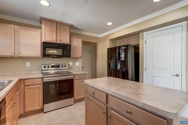 a kitchen with a stove and a microwave