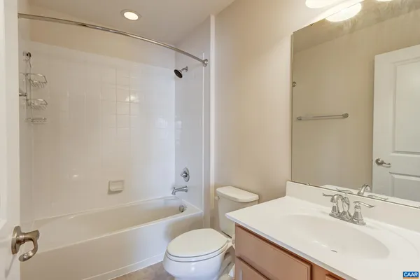 a bathroom with a sink a toilet and a bathtub