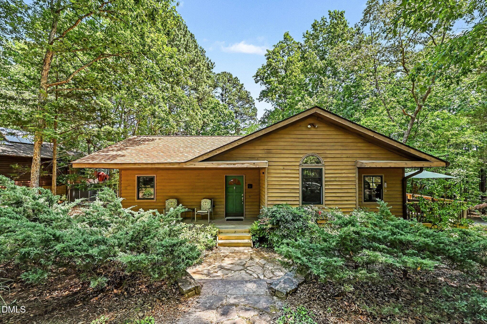 200 Spring Valley Road Carrboro, NC 27510 - Photo 2 of 38 a view of a house with yard and garden