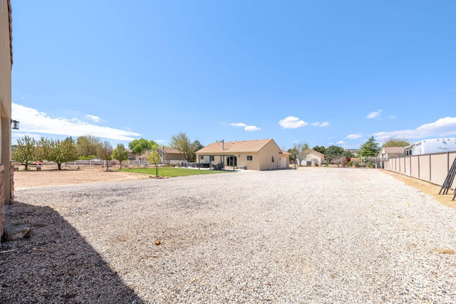 7776 Wagon Road East St. George, UT 84770 - Photo 62 of 76 View of yard with a residential view