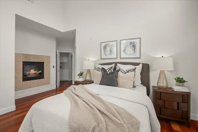 a bedroom with a bed and a fireplace