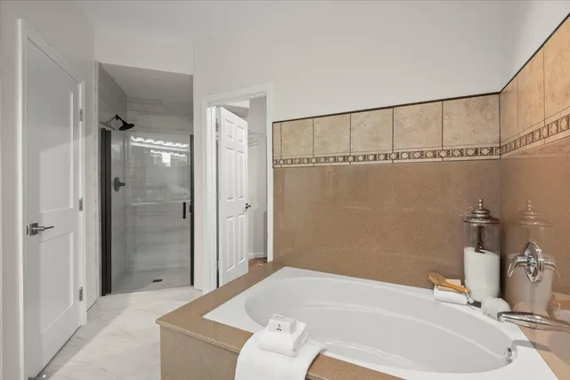 a bathroom with a tub and a sink