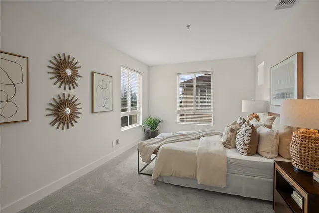 a bedroom with bed and window