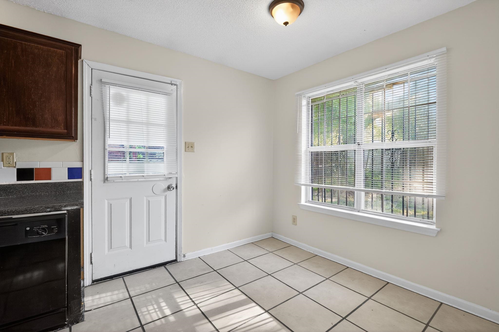 3820 Clarke Road Memphis, TN 38115 - Photo 5 of 30 Doorway with tile patterned flooring and a textured ceiling
