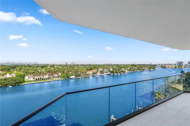 a bedroom with a bed and large window