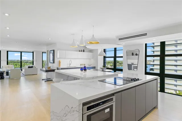 a bathroom with a sink mirror and vanity