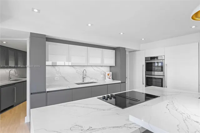 a spacious bathroom with a double vanity sink and mirror