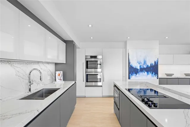 a dining room with a large window and furniture