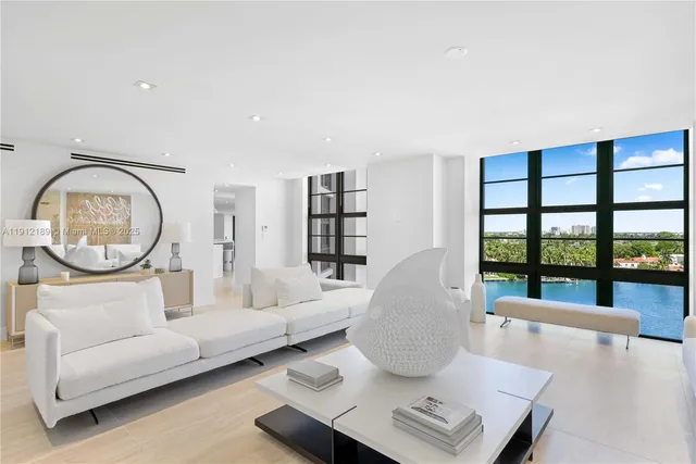 a view of a swimming pool and lounge chairs
